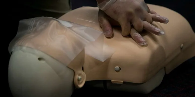 CPR training on a medical mannequin.