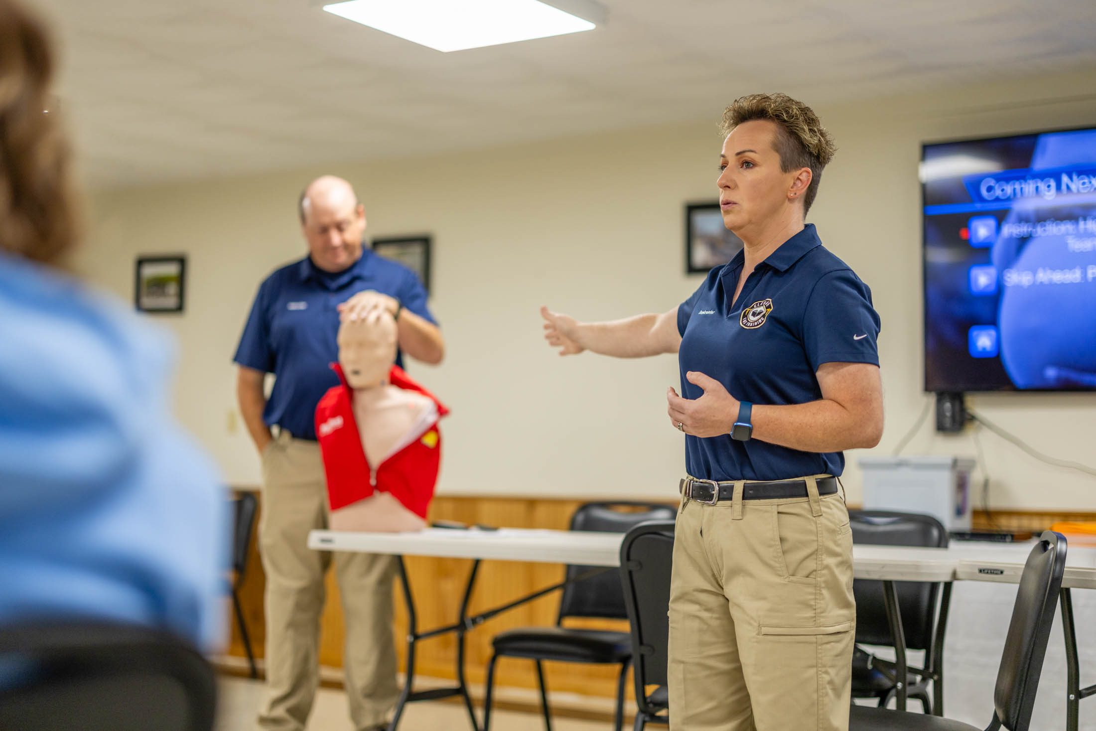 First aid training session with CPR demonstration.